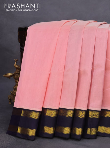 Silk cotton saree peach shade and dark blue with plain body and rettapet zari woven korvai border