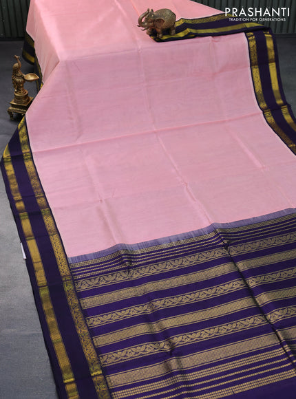 Silk cotton saree peach shade and dark blue with plain body and rettapet zari woven korvai border