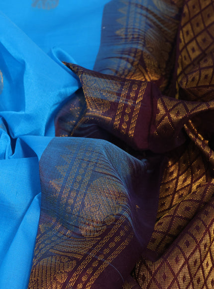 Silk cotton saree light blue and wine shade with elephant zari woven buttas and rich long zari woven korvai border