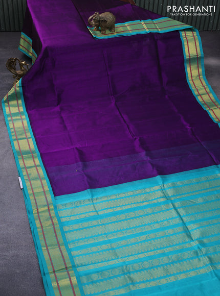 Silk cotton saree purple and teal blue with plain body and zari woven korvai border