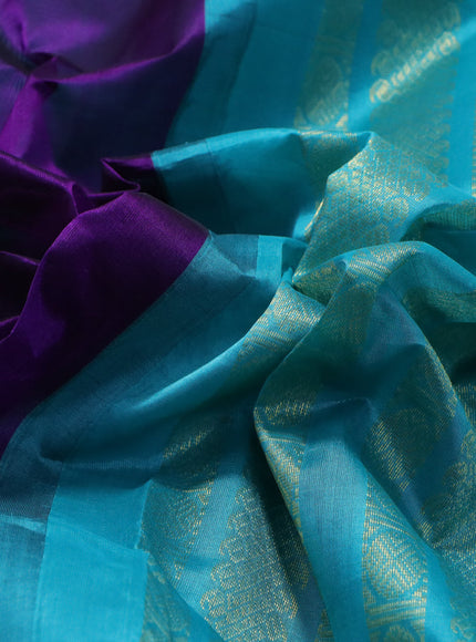 Silk cotton saree purple and teal blue with plain body and zari woven korvai border