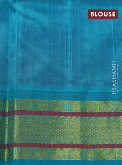 Silk cotton saree purple and teal blue with plain body and zari woven korvai border