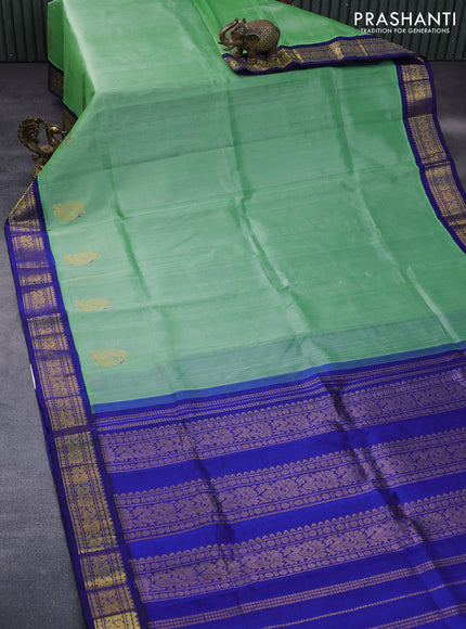 Silk cotton saree green and blue with plain body and annam zari woven korvai border