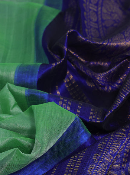 Silk cotton saree green and blue with plain body and annam zari woven korvai border