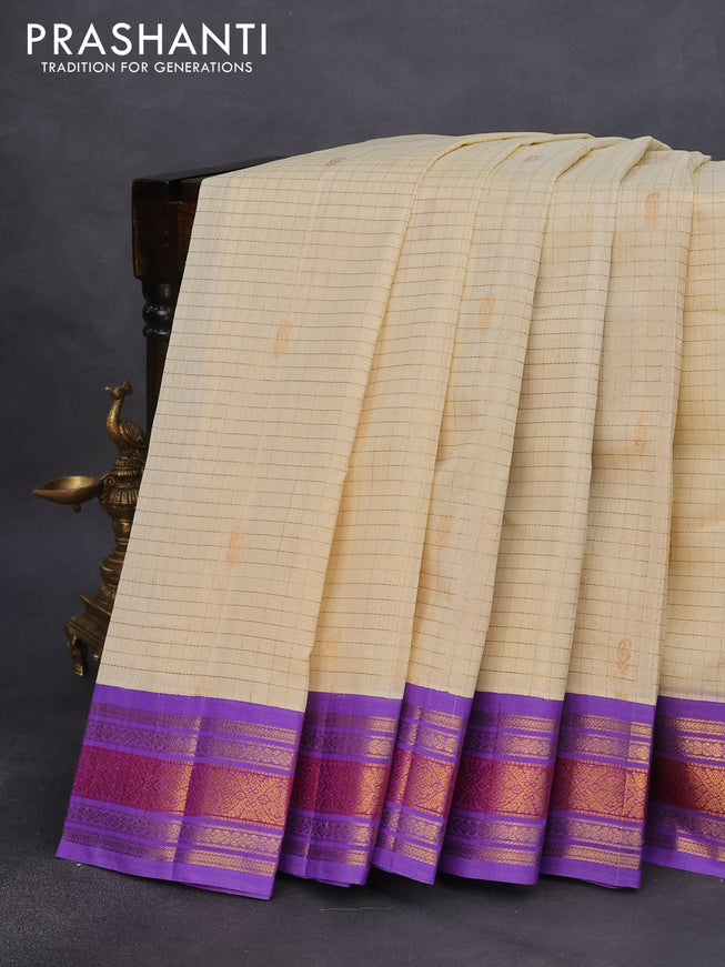 Silk cotton saree cream and lavender with allover zari checks & buttas and zari woven korvai border