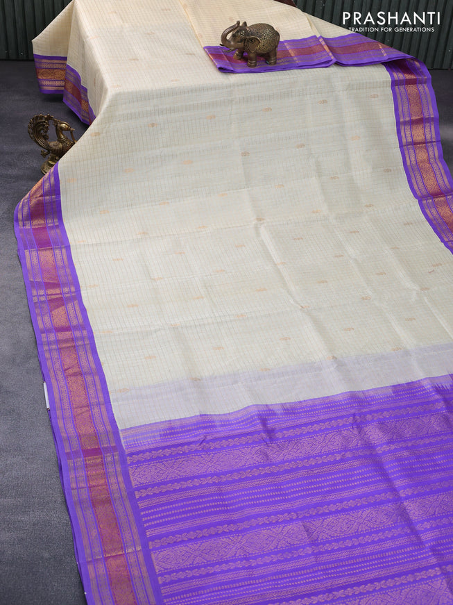 Silk cotton saree cream and lavender with allover zari checks & buttas and zari woven korvai border