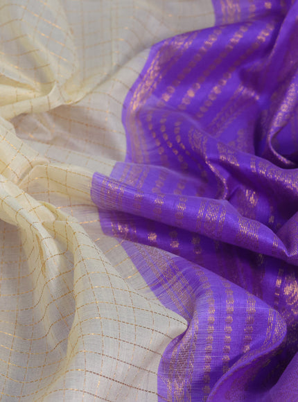 Silk cotton saree cream and lavender with allover zari checks & buttas and zari woven korvai border