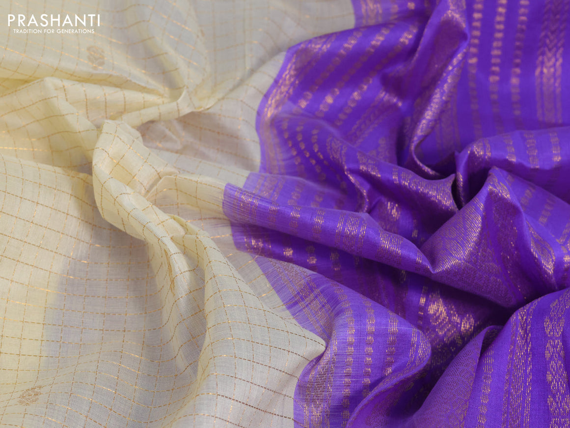 Silk cotton saree cream and lavender with allover zari checks & buttas and zari woven korvai border