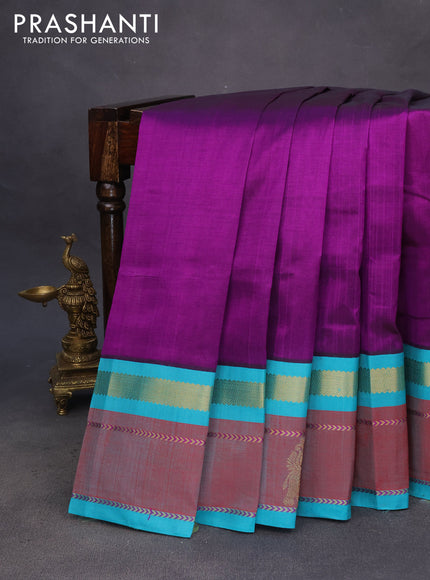 Silk cotton saree purple and teal blue with plain body and zari woven butta korvai border