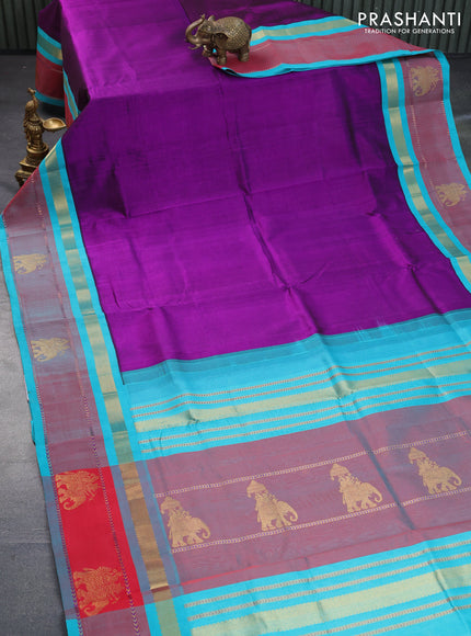 Silk cotton saree purple and teal blue with plain body and zari woven butta korvai border