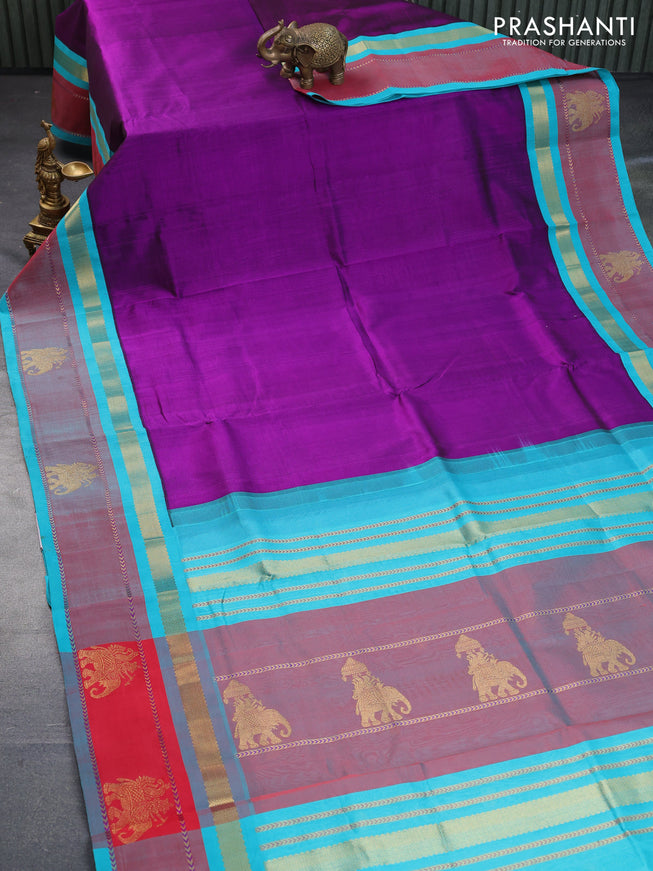 Silk cotton saree purple and teal blue with plain body and zari woven butta korvai border