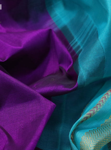 Silk cotton saree purple and teal blue with plain body and zari woven butta korvai border