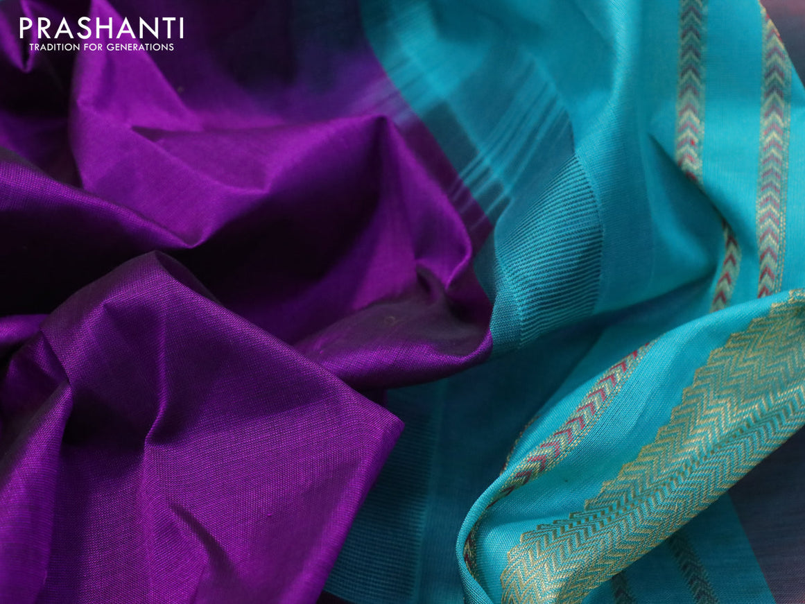 Silk cotton saree purple and teal blue with plain body and zari woven butta korvai border