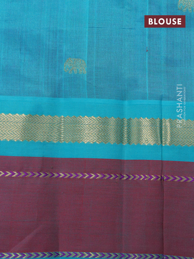 Silk cotton saree purple and teal blue with plain body and zari woven butta korvai border