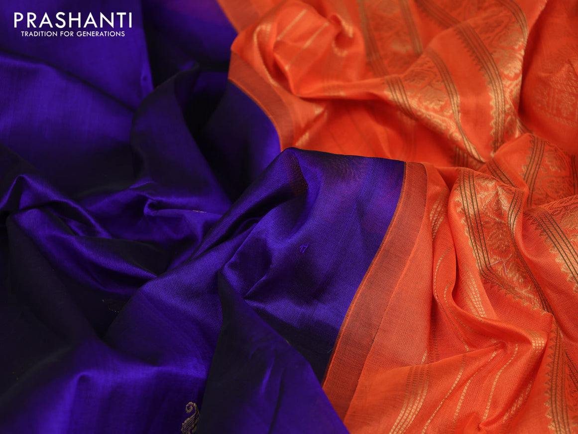 Silk cotton saree blue and orange with plain body and rettapet zari woven korvai border