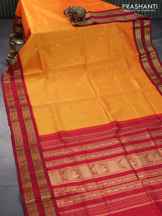 Silk cotton saree mango yellow and maroon with plain body and rettapet zari woven korvai border