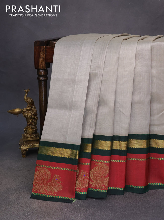 Silk cotton saree grey and green with plain body and zari woven annam butta korvai border