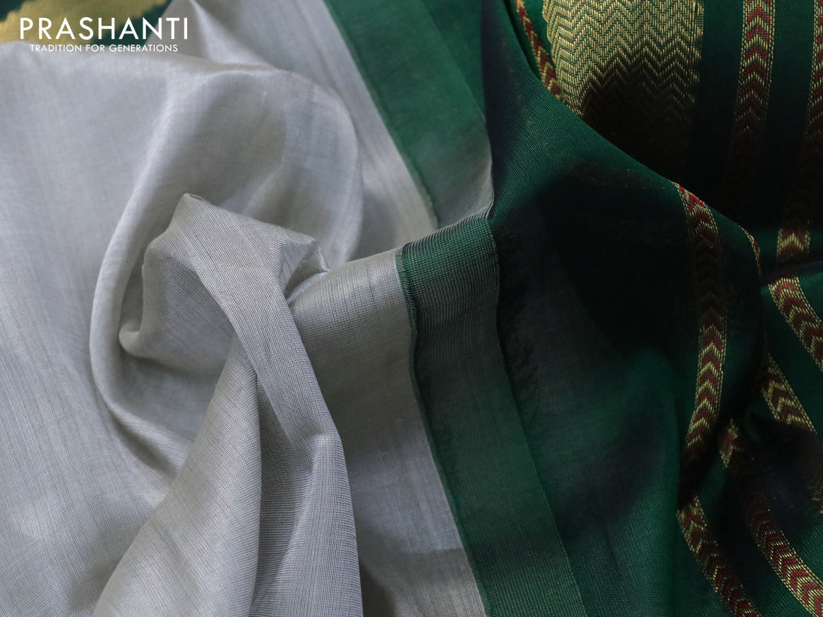 Silk cotton saree grey and green with plain body and zari woven annam butta korvai border