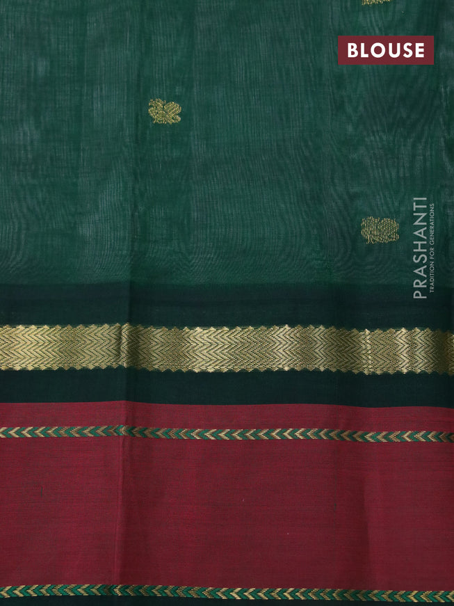 Silk cotton saree grey and green with plain body and zari woven annam butta korvai border