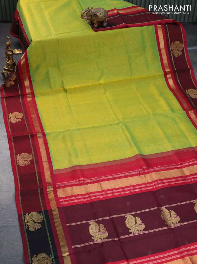 Silk cotton saree dual shade of light green and kumkum red with plain body and zari woven annam butta korvai border