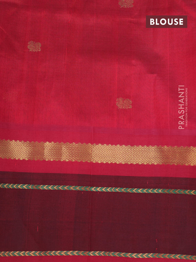 Silk cotton saree dual shade of light green and kumkum red with plain body and zari woven annam butta korvai border