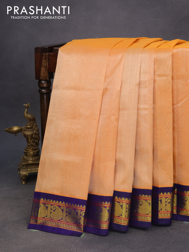 Silk cotton saree pale orange and blue with plain body and paisley zari woven korvai border