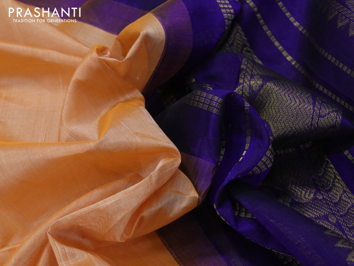 Silk cotton saree pale orange and blue with plain body and paisley zari woven korvai border