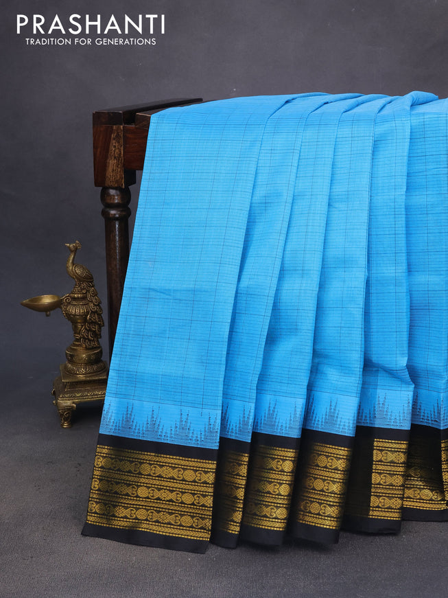 Silk cotton saree blue and black with allover checked pattern and temple design zari woven korvai border