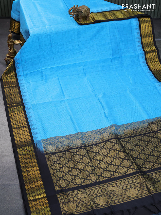 Silk cotton saree blue and black with allover checked pattern and temple design zari woven korvai border