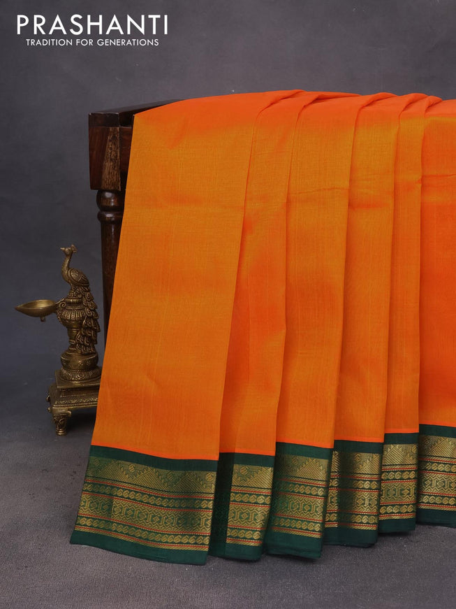 Silk cotton saree mango yellow and bottle green with plain body and zari woven korvai border