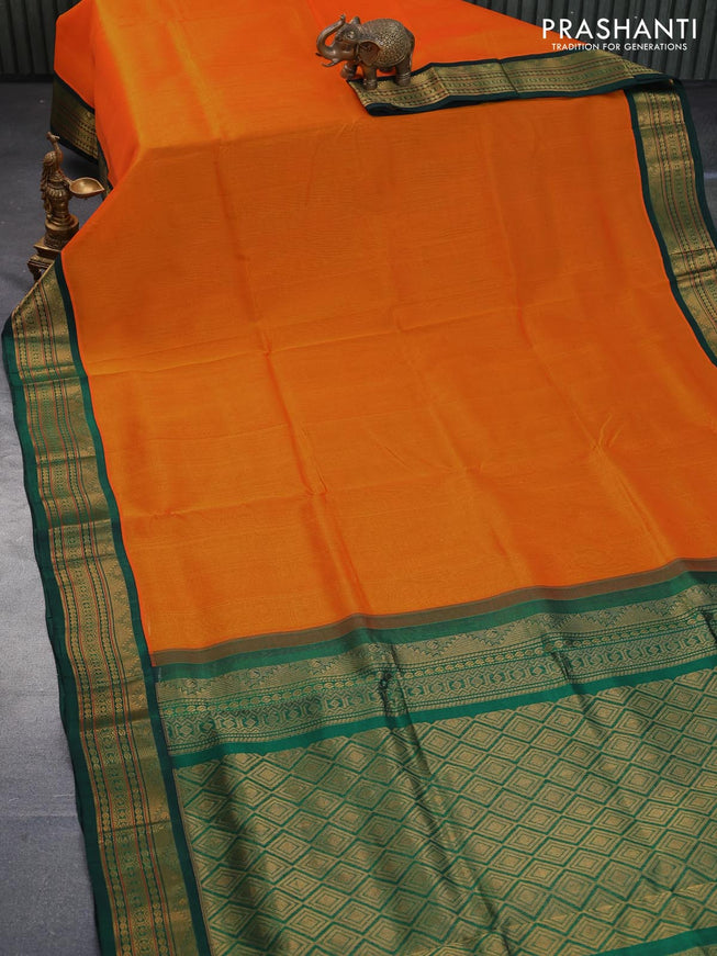 Silk cotton saree mango yellow and bottle green with plain body and zari woven korvai border