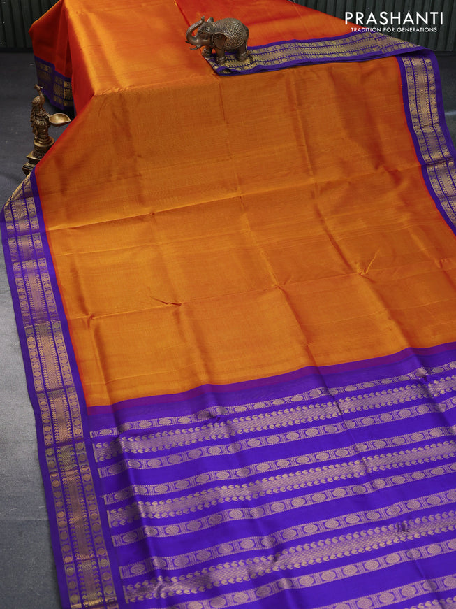 Silk cotton saree rustic orange and blue with plain body and zari woven korvai border