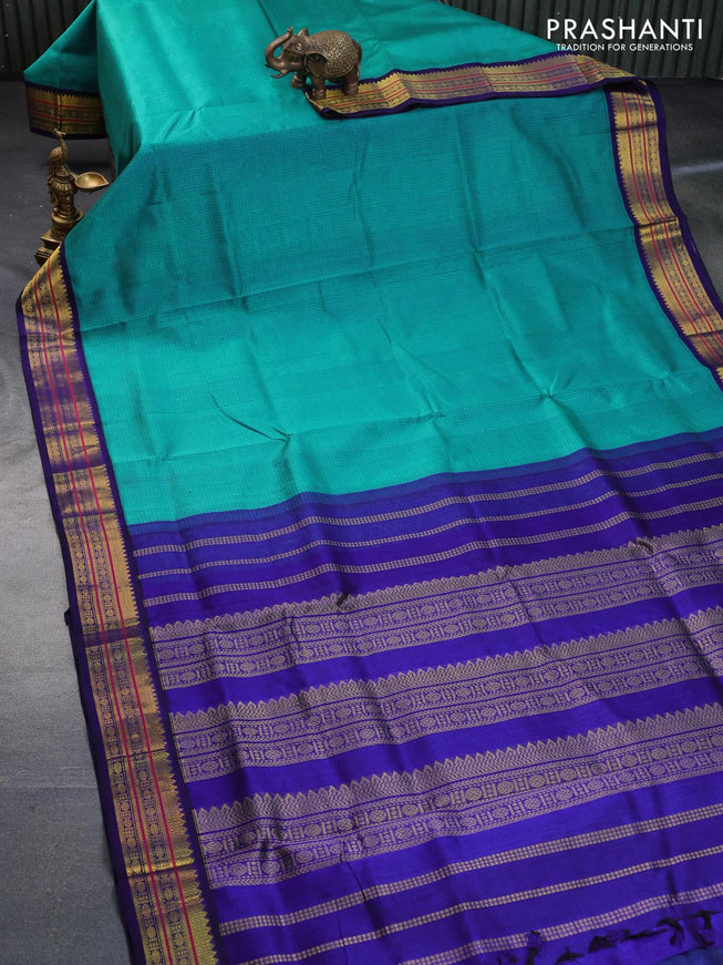 Silk cotton saree teal green and blue with allover checked pattern and zari woven korvai border