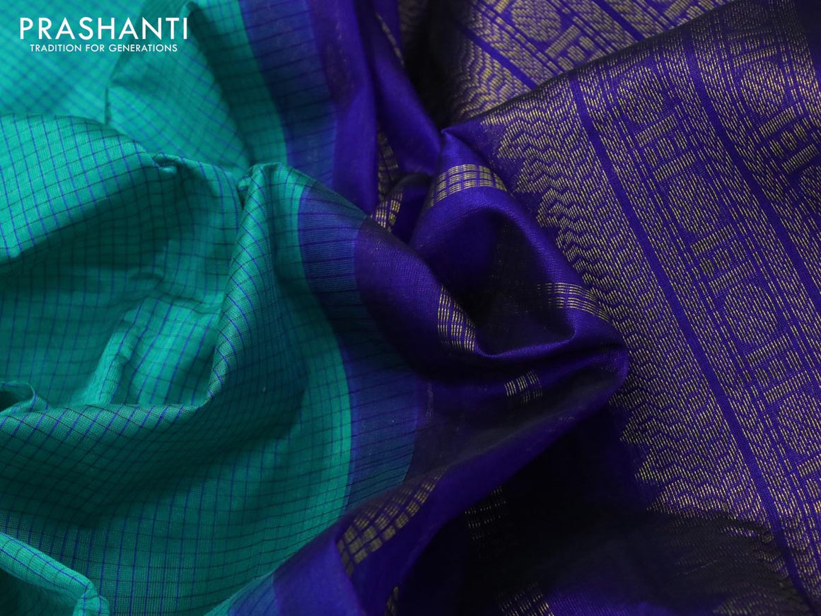 Silk cotton saree teal green and blue with allover checked pattern and zari woven korvai border