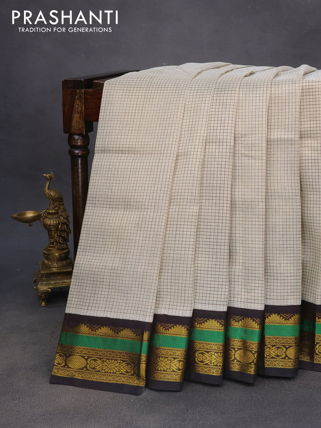 Silk cotton saree cream and deep coffee brown with allover checked pattern and zari woven korvai border