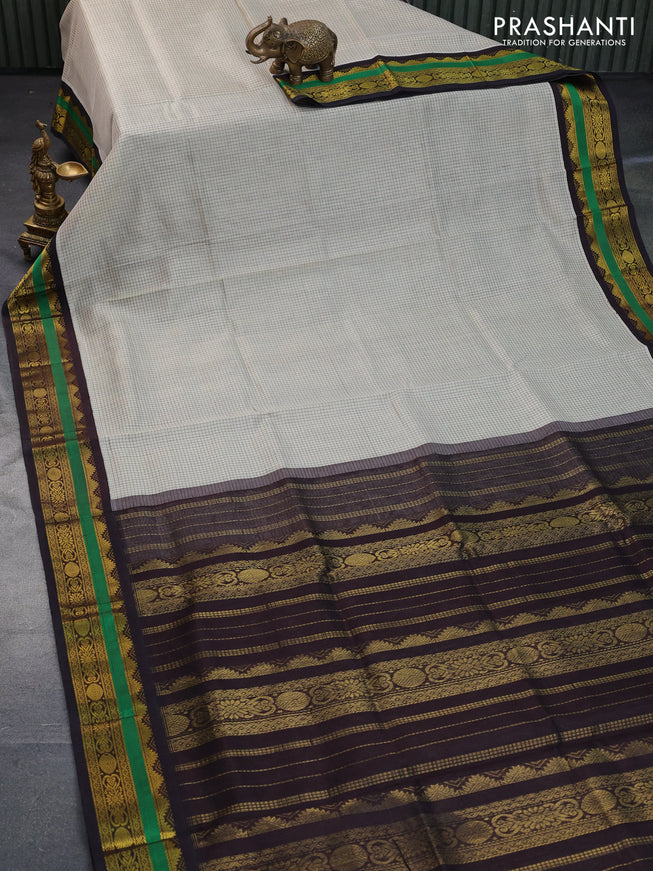 Silk cotton saree cream and deep coffee brown with allover checked pattern and zari woven korvai border