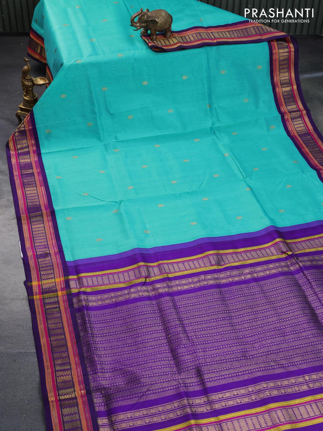 Silk cotton saree teal blue and violet with zari woven buttas and zari woven korvai border