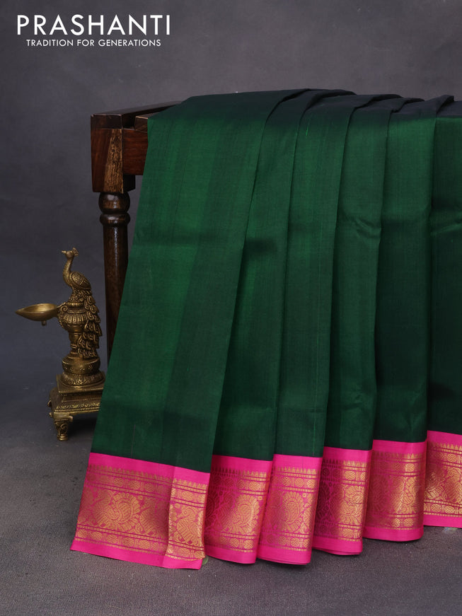 Silk cotton saree dark green and pink with plain body and annam zari woven korvai border