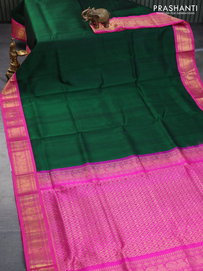 Silk cotton saree dark green and pink with plain body and annam zari woven korvai border