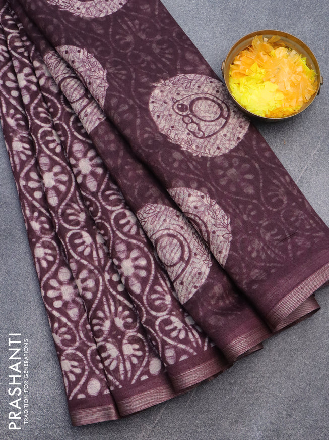 Semi linen saree wine shade with allover batik prints and zari woven border