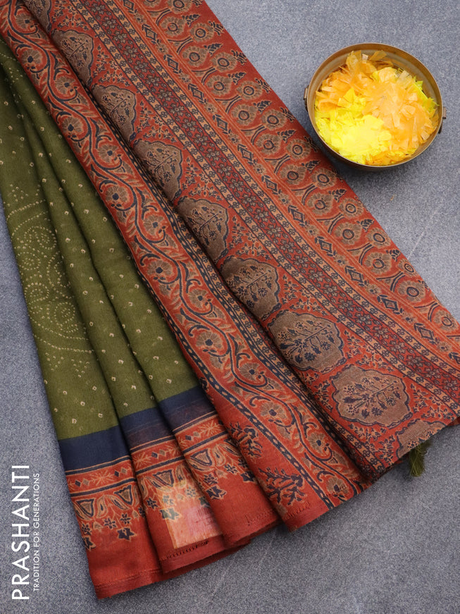 Semi linen saree sap green and rust shade with allover bandhani prints and ajrakh printed pallu