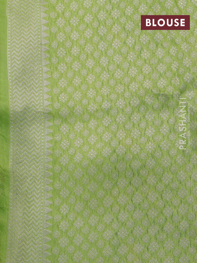 Banarasi raw silk saree fluorescent green with thread & zari woven floral buttas and long floral zari woven paithani border