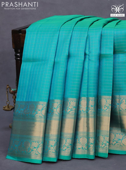 Pure soft silk saree dual shade of teal blue with allover zari woven checked pattern and long annam zari woven border