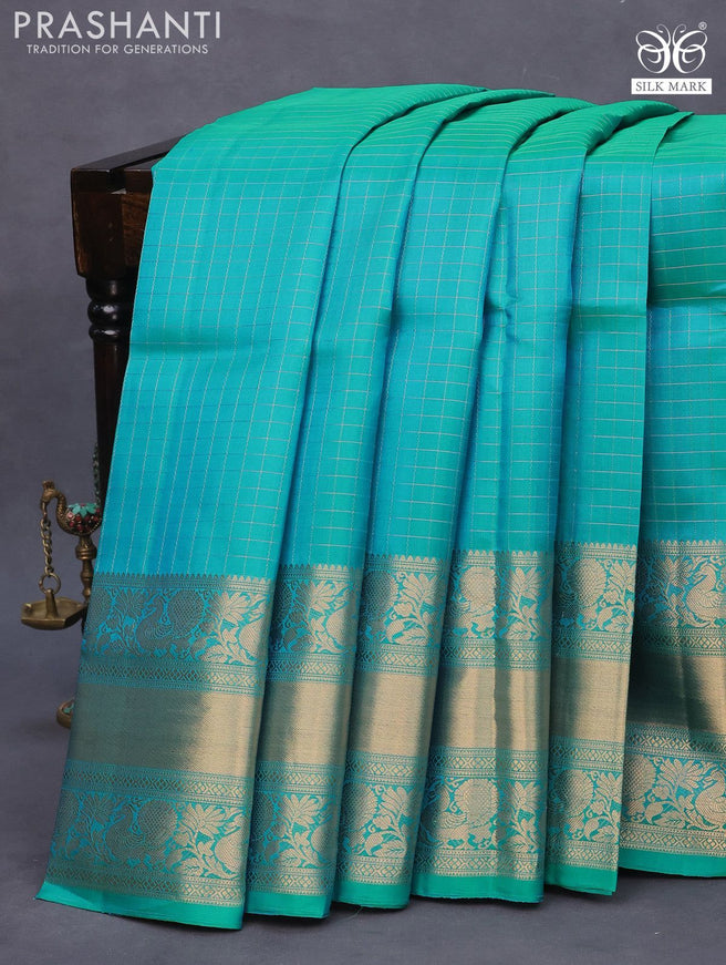 Pure soft silk saree dual shade of teal blue with allover zari woven checked pattern and long annam zari woven border