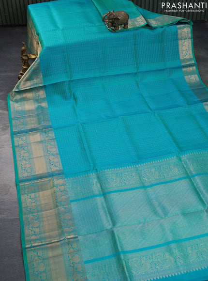 Pure soft silk saree dual shade of teal blue with allover zari woven checked pattern and long annam zari woven border