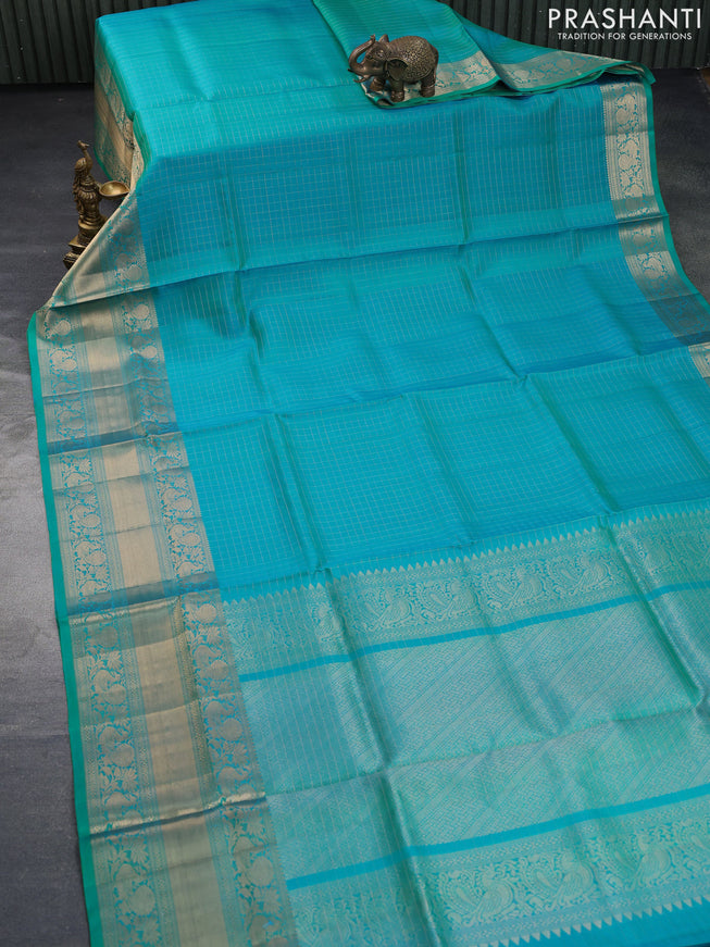 Pure soft silk saree dual shade of teal blue with allover zari woven checked pattern and long annam zari woven border