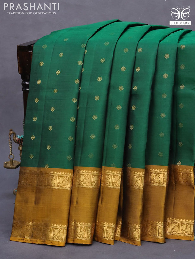 Pure soft silk saree green and dark mustard with allover zari woven buttas and rettapet zari woven border