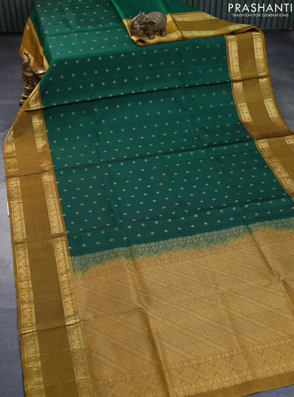 Pure soft silk saree green and dark mustard with allover zari woven buttas and rettapet zari woven border