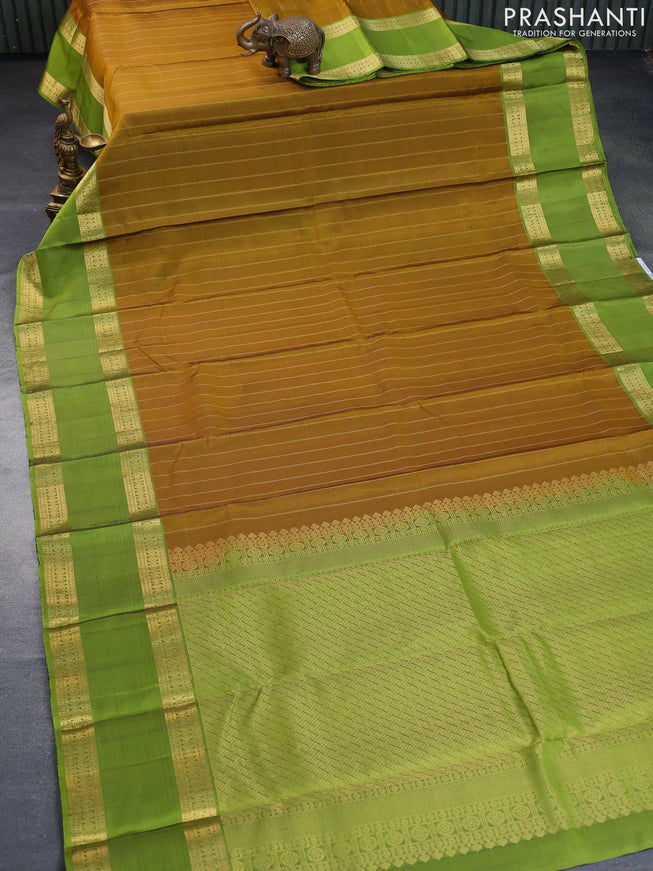 Pure soft silk saree dark mustard and light green with allover zari stripe weaves and long rettapet zari woven border