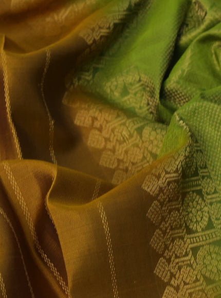 Pure soft silk saree dark mustard and light green with allover zari stripe weaves and long rettapet zari woven border